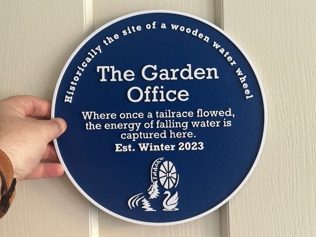 Holding up a customers blue plaque order (deep blue)